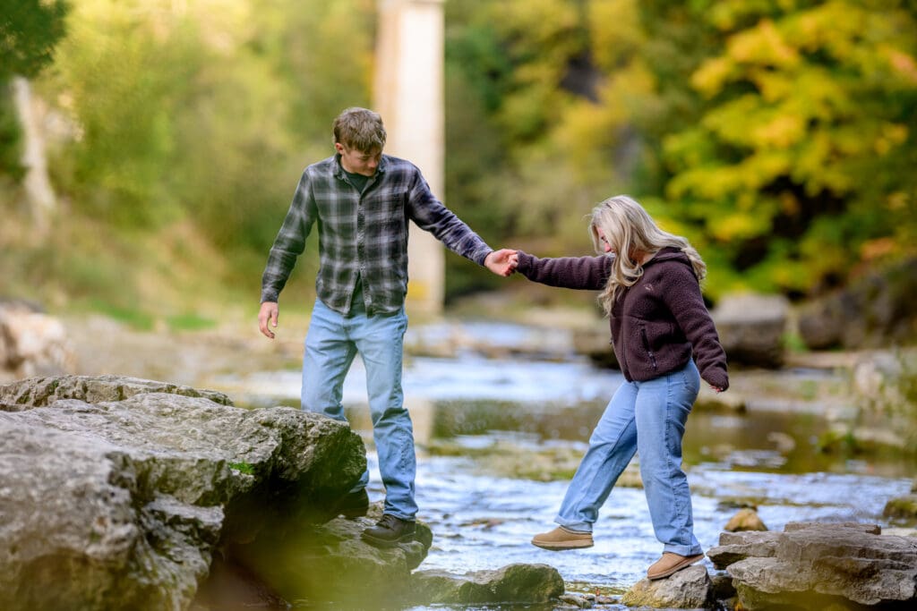 Scenic engagement photo at Elora Gorge with dramatic rock formations, trees, and flowing river