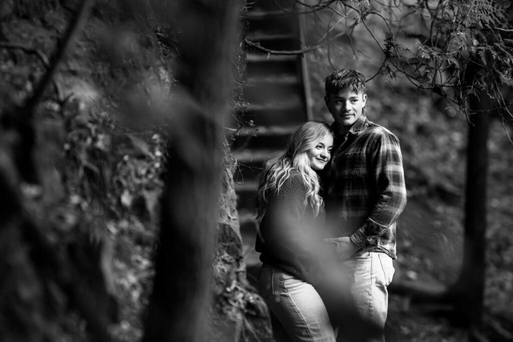 Scenic engagement photo at Elora Gorge with dramatic rock formations, trees, and flowing river